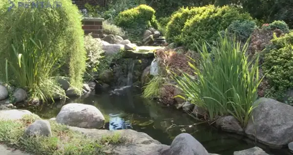 A garden waterfall and pond requires a small submersible utility pump to keep the water flowing.