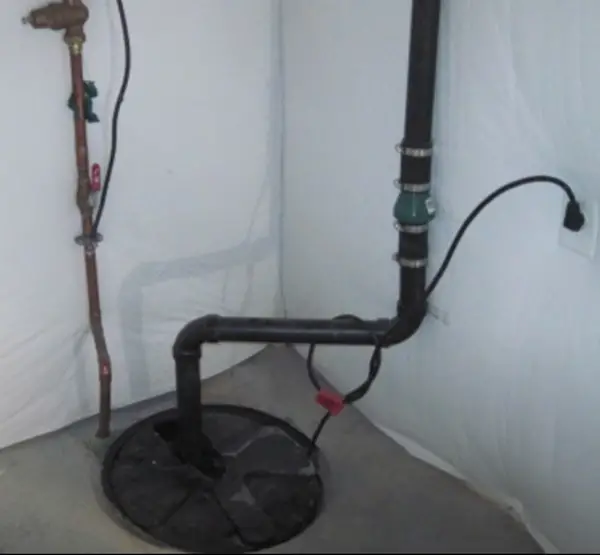 Typical sump pump installation. Sump pump installation mistakes include placing the pump in a place that is hard to reach for maintenance or repairs.